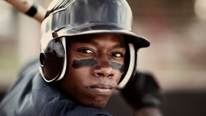 Why is it important for a baseball player to wear a hat